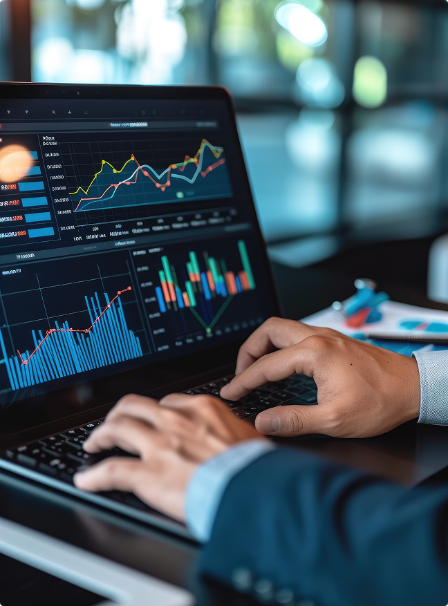 Close-up of investor analyzing real estate performance and financial data charts on a laptop, illustrating Brookline’s data-driven investment approach.