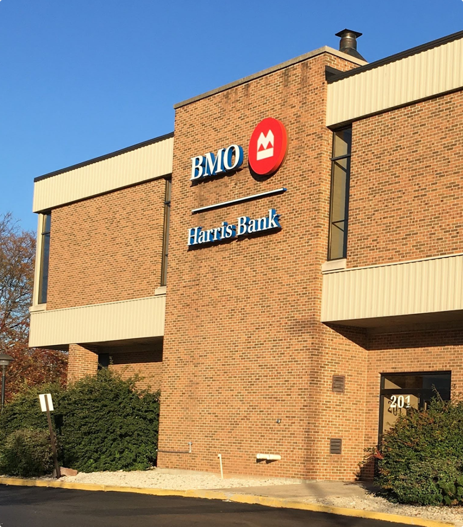 Exterior of a BMO Harris Bank commercial building with prominent signage and brick facade—an example of a Brookline-managed sale-leaseback asset.